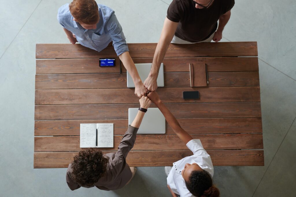 A startup team fist pumping and ready to work on finding backlinks